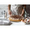 Moule à tarte amovible 28 cm inox perforé et feuille de cuisson antiadhésive De Buyer